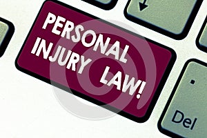 Handwriting text writing Personal Injury Law. Concept meaning guarantee your rights in case of hazards or risks Keyboard