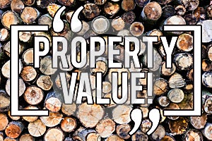 Handwriting text writing Property Value. Concept meaning Estimate of Worth Real Estate Residential Valuation Wooden background