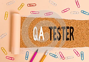 Handwriting text writing Qa Tester. Concept meaning Quality assurance of an on going project before implementation.