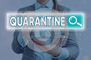 Handwriting text writing Quarantine. Concept meaning restraint upon the activities of an individual or the transport of photo