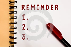 Handwriting text writing Reminder. Concept meaning thing that causes someone to remember something event or date Marker