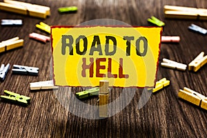 Handwriting text writing Road To Hell. Concept meaning Extremely dangerous passageway Dark Risky Unsafe travel Clothespin holding