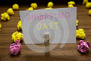 Handwriting text writing Shopping Cart. Concept meaning Case Trolley Carrying Groceries and Merchandise Clothespin holding white p