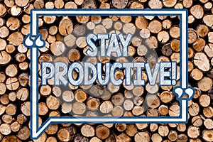 Handwriting text writing Stay Productive. Concept meaning Efficiency Concentration Productivity Wooden background