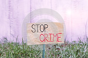 Handwriting text writing Stop Crime. Concept meaning the effort or attempt to reduce and deter crime and criminals Plain