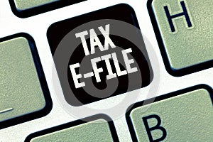 Handwriting text writing Tax E File. Concept meaning System submitting tax documents to US Internal Revenue Service