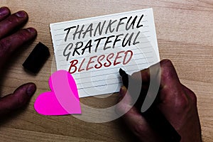 Handwriting text writing Thankful Grateful Blessed. Concept meaning Appreciation gratitude good mood attitude Written on notepad h