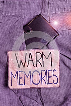 Handwriting text writing Warm Memories. Concept meaning Something that you remember with pleasure Sweet reminiscences Small little photo