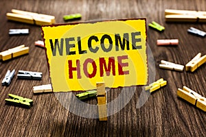 Handwriting text writing Welcome Home. Concept meaning Expression Greetings New Owners Domicile Doormat Entry Clothespin holding y