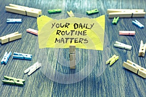 Handwriting text Your Daily Routine Matters.. Concept meaning Have good habits to live a healthy life Paperclip hold written torn