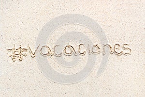 Handwriting words `Vacaciones` in spanish photo
