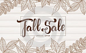 Handwritten brush lettering of Fall Sale on wood texture background. Discount special offer.