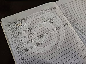 Handwritten Javanese script written by students in school.