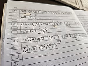 Handwritten Javanese script written by students in school.