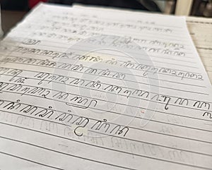 Handwritten Javanese script written by students in school.