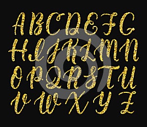 Handwritten latin calligraphy brush script of capital letters. Gold glitter alphabet. Vector