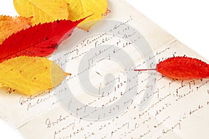 Handwritten letter with autumn leaves