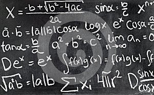 Handwritten mathematical formulas on blackboard written.