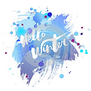 Handwritten modern lettering Hello Winter on watercolor imitation blue background.