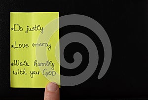 Handwritten note with an old testament Bible verse Micah 6:8 prophet, justice, mercy, love, humility biblical concept