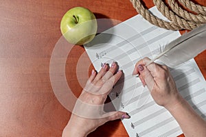 Handwritten notes and a treble clef. A sheet of paper with notes.