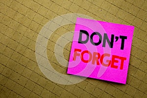 Handwritten text caption showing Do Not Forget. Business concept writing for Don t memory Remider written on sticky note paper on