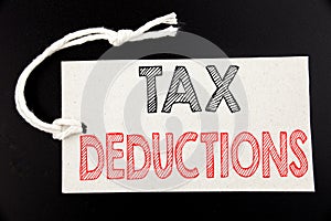 Handwritten text caption showing Tax Deductions. Business concept writing for Finance Incoming Tax Money Deduction written on pric