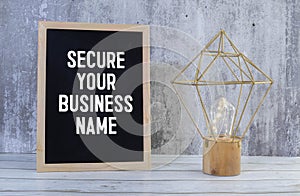 Handwritten text SECURE YOUR BUSINESS NAME, business success concept