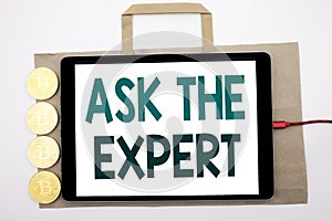 Handwritten text showing Ask The Expert. Business concept writing for Advice Help Question Written on shopping bag and tablet with