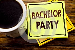 Handwritten text showing Bachelor Party. Business concept for Stag Fun Celebrate written on sticky note paper on the wooden wood b photo