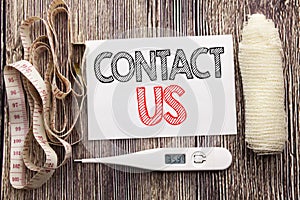 Handwritten text showing Contact Us. Business fitness health concept writing for Customer Support written sticky note empty paper