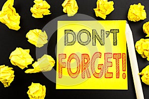 Handwritten text showing Do Not Forget. Business concept writing for Reminder Message written on sticky note paper on the black ba