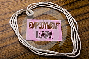 Handwritten text showing Employment Law. Business concept for Employee Legal Justice written on sticky note paper on the dark wood photo