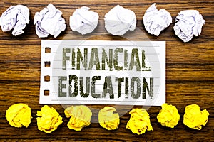 Handwritten text showing Financial Education. Business concept for Finance Knowledge Written on sticky note, wooden with sticky, m