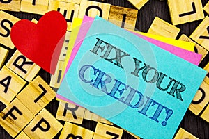 Handwritten text showing Fix Your Credit. Conceptual photo Bad Score Rating Avice Fix Improvement Repair written on colorful stick