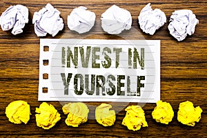 Handwritten text showing Invest In Yourself. Business concept for Self Motivation Written on sticky note, wooden with sticky, many