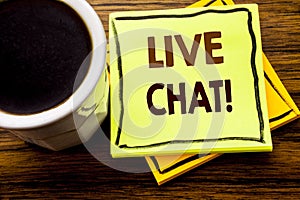 Handwritten text showing Live Chat . Business concept for Communication Livechat written on sticky note paper on the wooden wood b photo