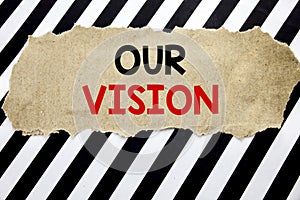 Handwritten text showing Our Vision. Business concept writing for Marketing Strategy Vision Written on note paper, black backgroun