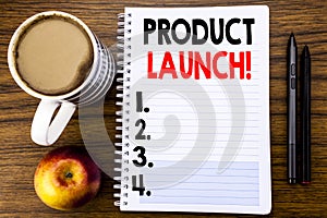 Handwritten text showing Product Launch. Business concept for New Products Start written on notepad note paper on the wood structu