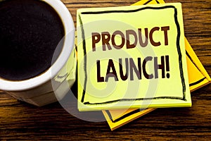 Handwritten text showing Product Launch. Business concept for New Products Start written on sticky note paper on the wooden wood b