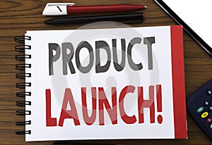 Handwritten text showing Product Launch. Business concept writing for New Products Start Written on notepad note paper, wooden bac
