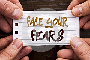 Handwritten text sign showing Face Your Fears. Business concept for Challenge Fear Fourage Confidence Brave Bravery written on Sti