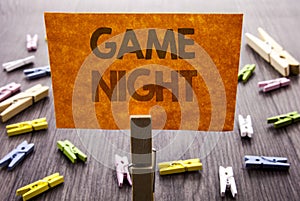 Handwritten text sign showing Game Night. Business concept for Entertainment Fun Play Time Event For Gaming written on sticky Note