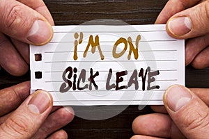 Handwritten text sign showing I m am On Sick Leave. Business concept for Vacation Holiday Absent Out Of Office Sickness Fever writ