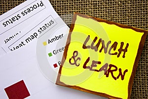 Handwritten text sign showing Lunch And Learn. Business concept for Presentation Training Board Course written on Sticky Note Pape