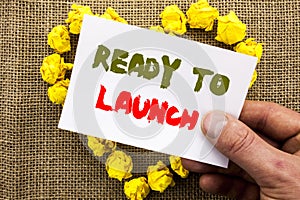 Handwritten text sign showing Ready To Launch. Conceptual photo Prepare New Product Promotion Start Release written on Sticky Note