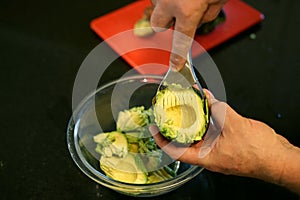 This handy kitchen tool slices avocados fast