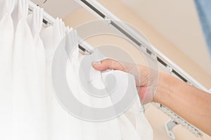 Handy man install curtain