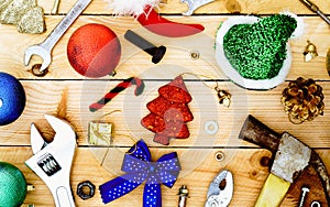 Handy Tools with Christmas decoration on wooden Background Copcept