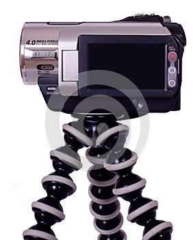 Handycam videocamera with black LCD on tripod